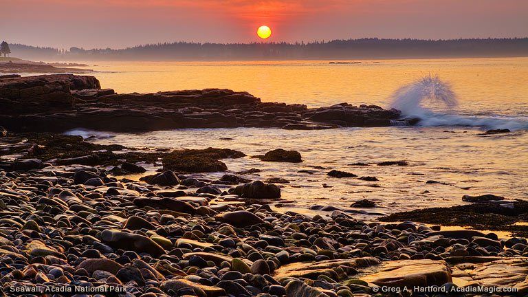 Open rocky shore at Seawall under a darkening sky